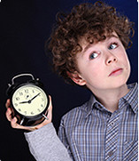 kid with alarm clock
